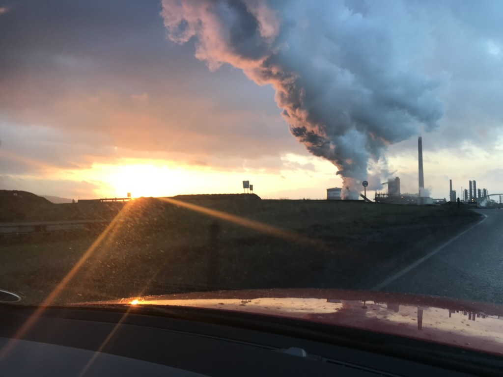 Refinery skyline at sunset — the environments the qualification is built for