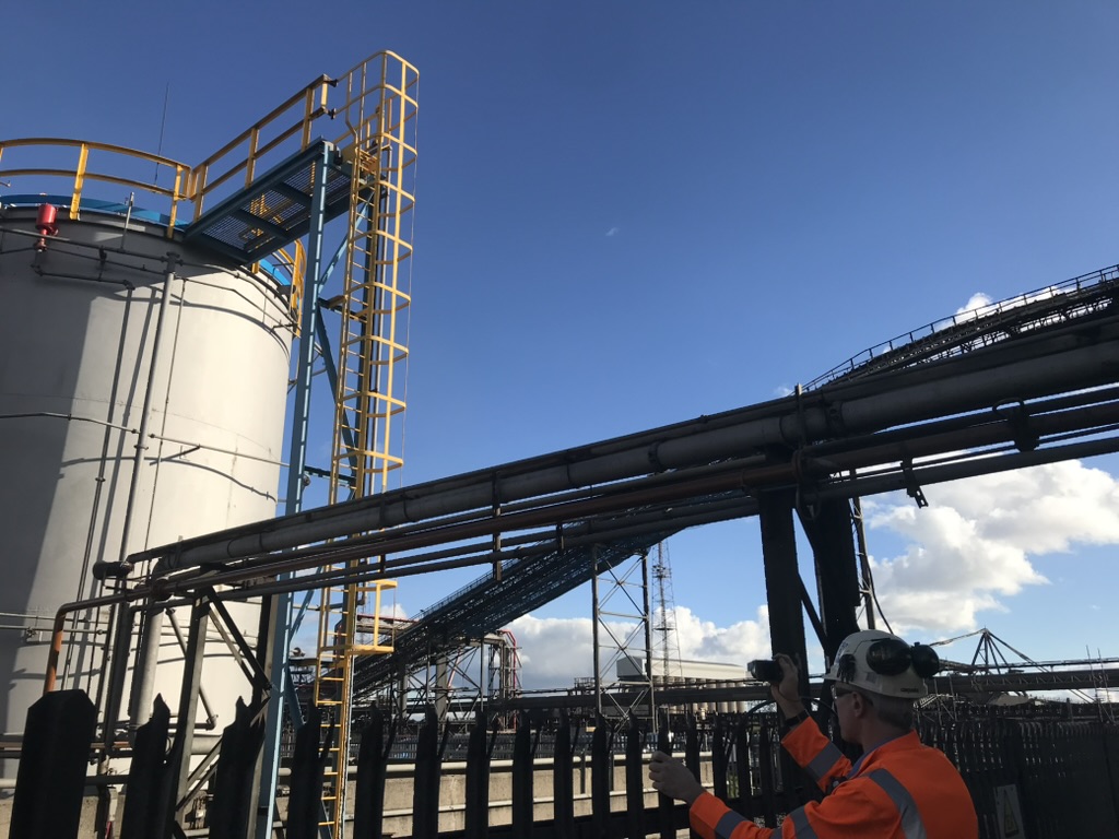 Storage silo and conveyor gantries in morning light